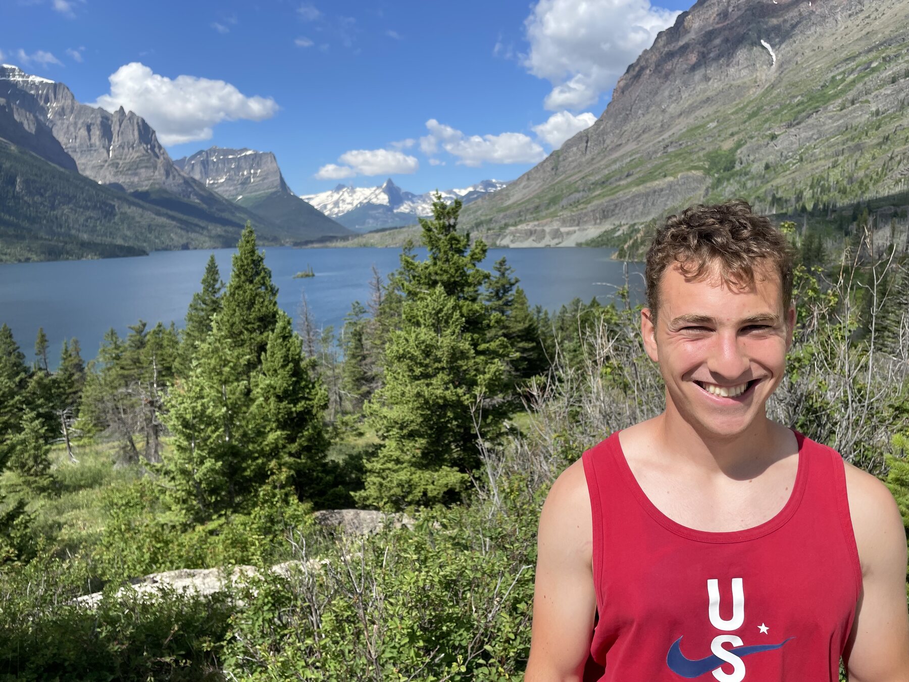 Zach overlooking a mountain lake in Glacier National Park