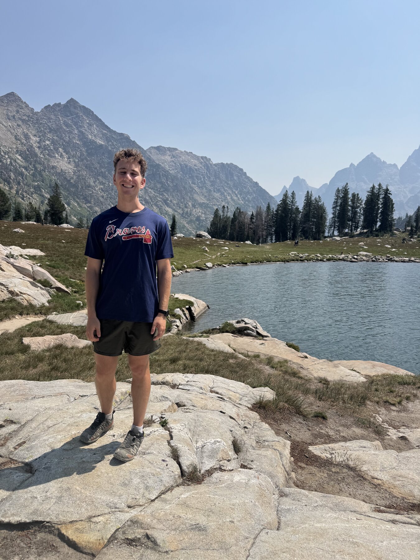 Zach beside an alpine lake in Grand Teton