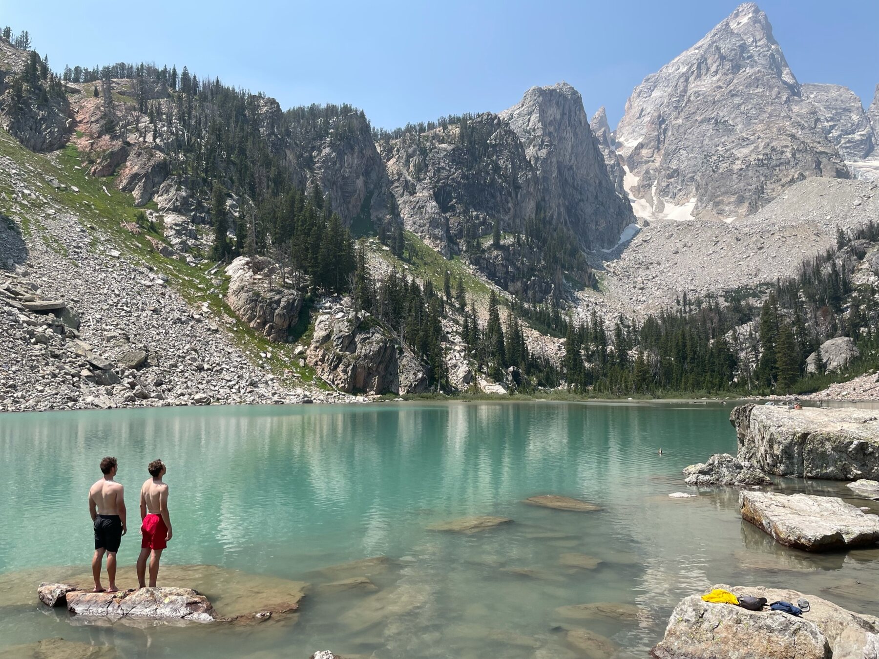 Zach and a friend at an alpine lake in Grand Teton